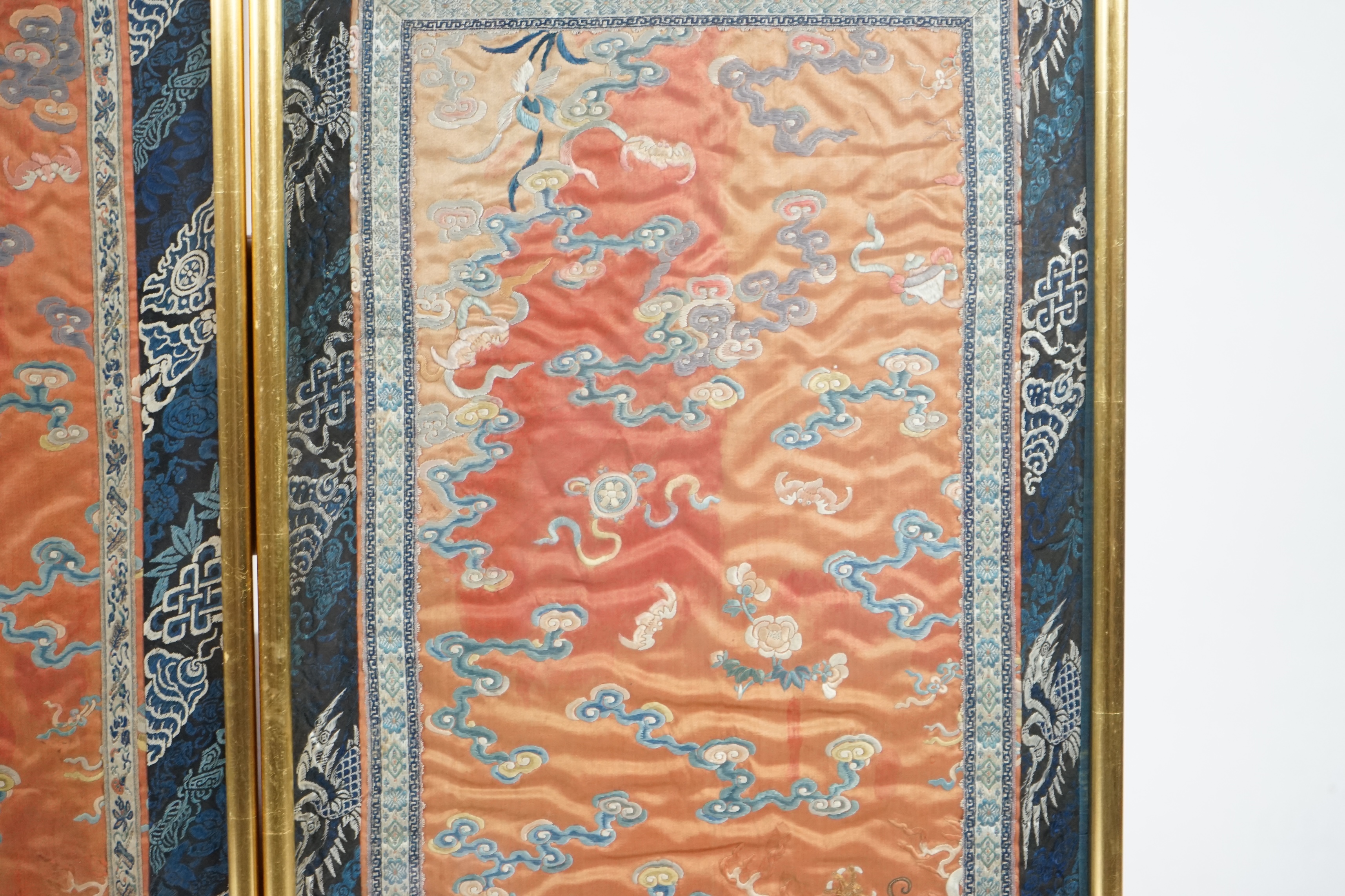 A pair of Chinese coral silk ‘dragon’ panels, 19th century